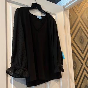 Black 3/4 sleeve with sheer sleeves and dots. Never been worn with tags.